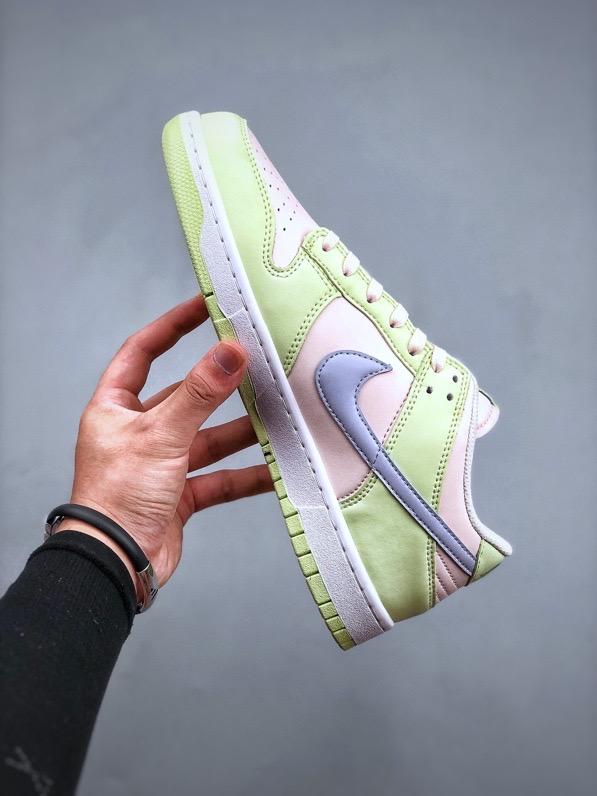 NIKE DUNK LOW Barely Green Nike Dunk Low 'Barely Green' sneaker featuring pastel green leather upper with peach-colored Swooshes.  The image showcases the Nike Dunk Low 'Barely Green' sneaker, highlighting its pastel green leather upper complemented by peach-colored Swooshes and a white midsole. The design offers a fresh and subtle aesthetic, perfect for various styles.

